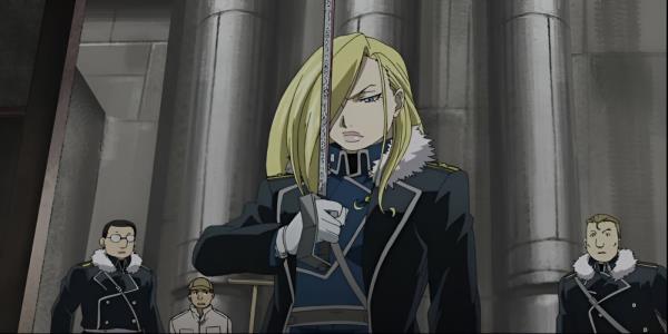 A woman with blond hair covering one eye and a military uniform looks solemn as she holds up a sword.