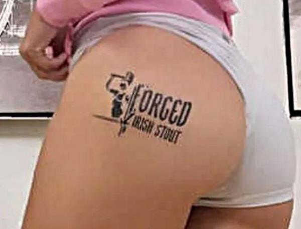 The Forged Irish Stout logo on Ebanie's buttock.